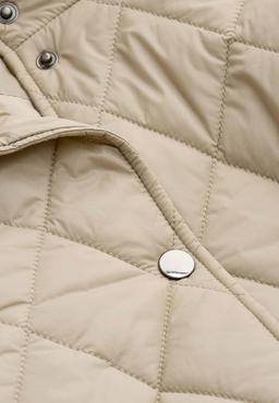 Beige quiltad jacka med tryckknappar
