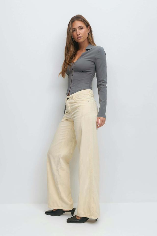 Låga vida manchesterjeans i gult dam