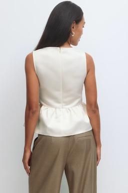 Vit peplumtopp för dam från Gina Tricot
