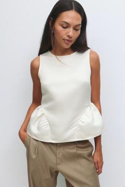 Vit peplumtopp för dam från Gina Tricot